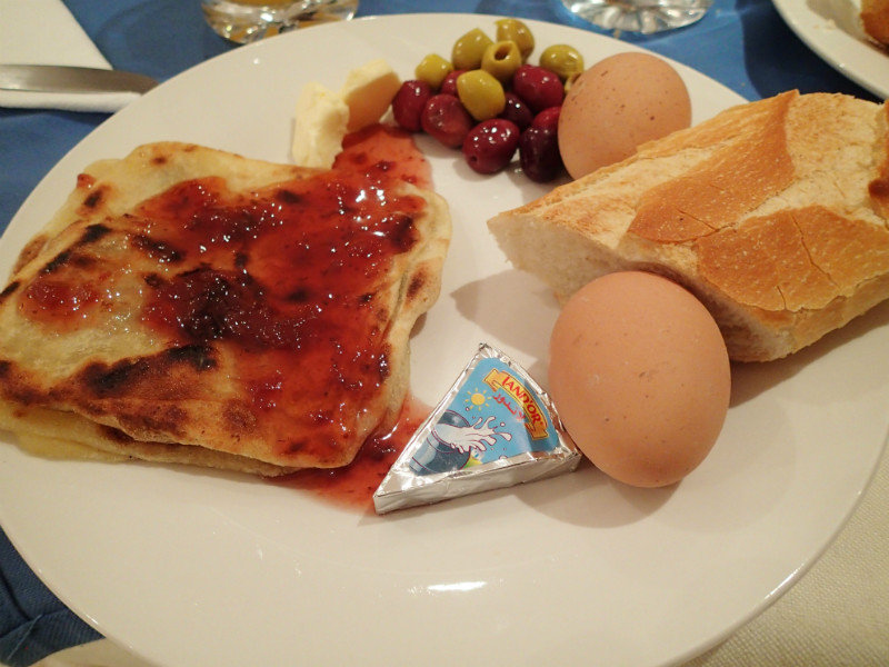Our typical breakfast.  Eggs, olives cheese, crepes, jam and bread.