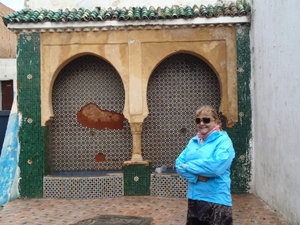 Ann at an old fountain in the Kasbah.