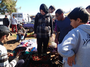 Khadija, Jacob, Edwin and Ali... buying strawberries.