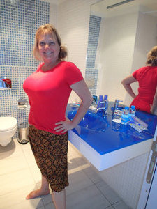 Ann modeling our bathroom in the hotel.