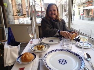 Miriam sitting down to eat lunch in Madrid.