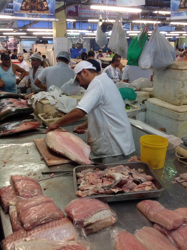 Preparing fish in the market