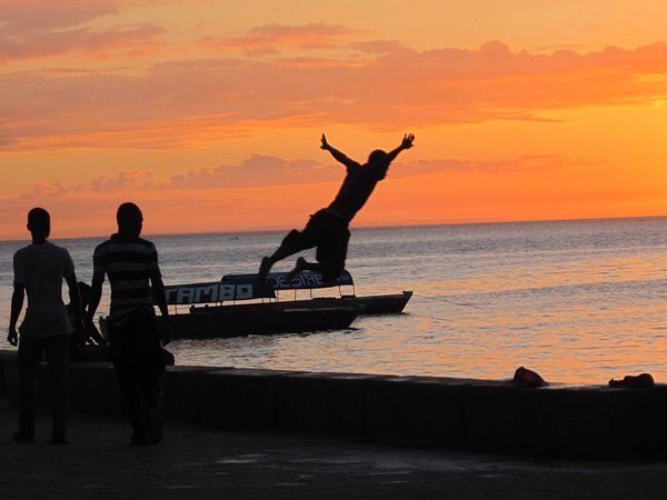 Boys jumping in the harbour, Stone Town