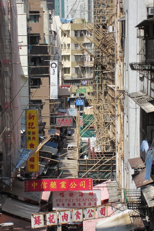 Bamboo scaffolding and signs everywhere