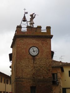 statue on clock tower
