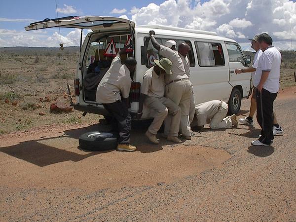How many men does it take to change a flat tire?