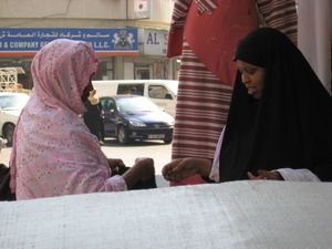 Some ladies of Dubai, buying clothes