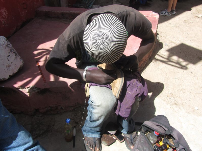 a shoe repairman - he spotted Ben's shoes in need of repair