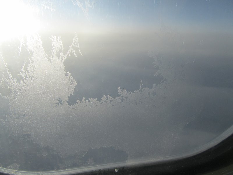 see the frost on the plane window as we get closer to Iceland