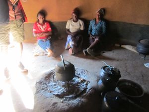 the ladies, preparing tea - they sit on the floor, while the men get to sit on the 'benches'