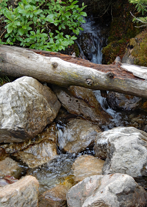 Rivulet contributes its steady action to draining melt water.