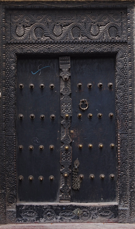 Studded carved door 