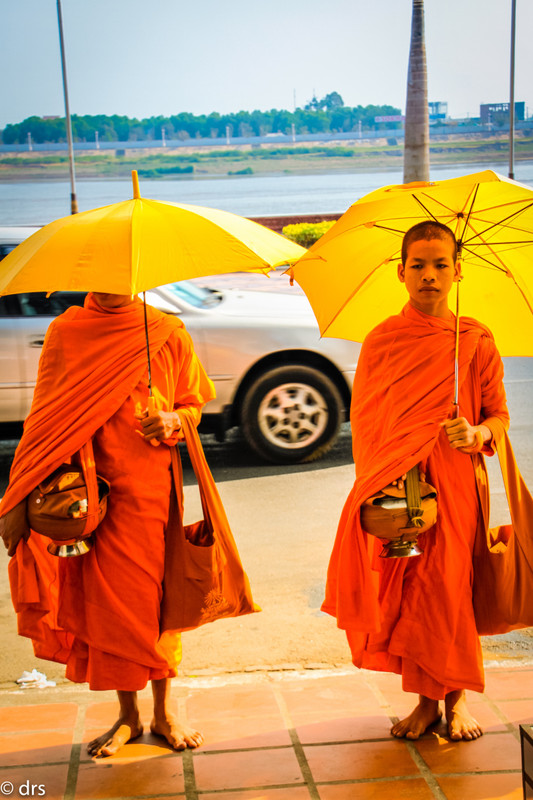 Buddhist monks with begging bowls