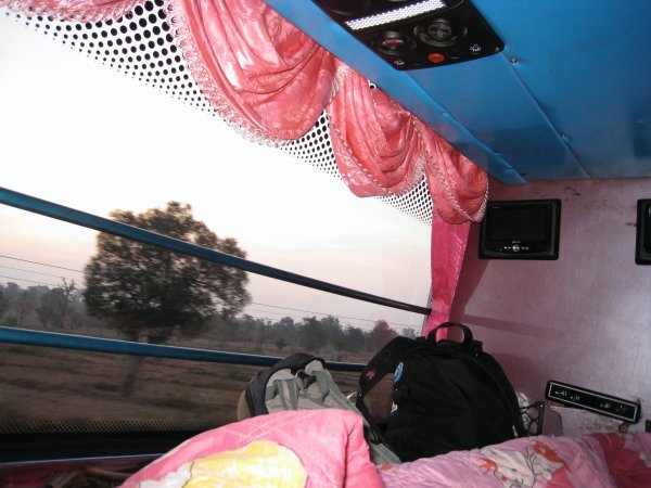 Lying down at the back of the bus