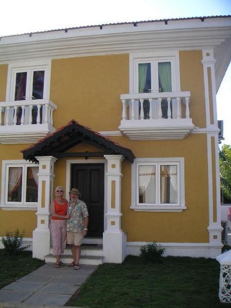 Janice and Tony in front of their new house
