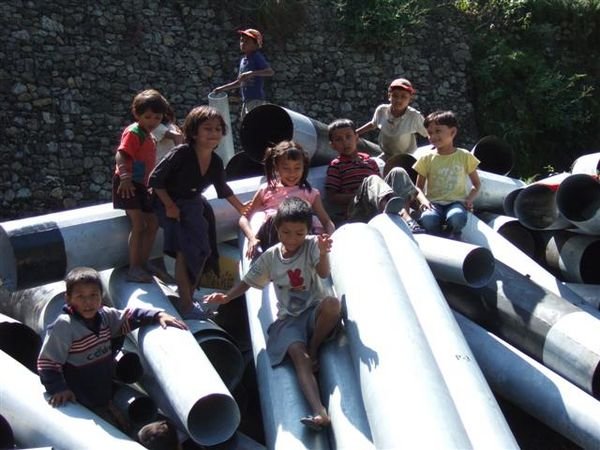 Children playing on pipes 