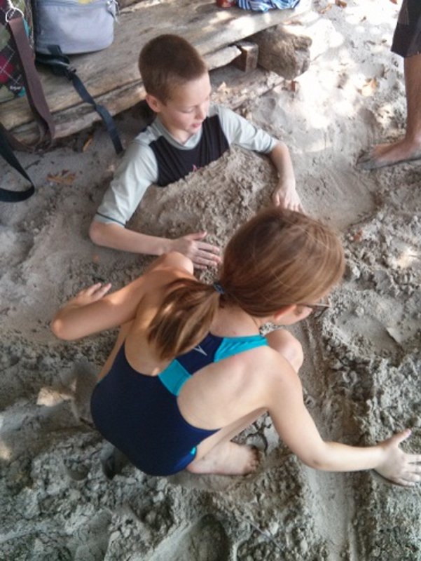 katie burying ian in the sand at Manuel Antonio