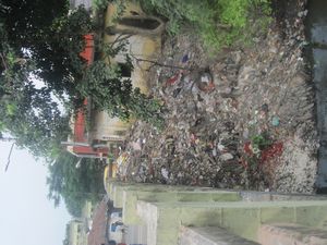 Garbage heap into water stream