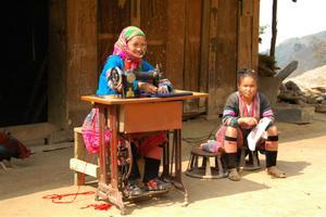 Hmong women sewing