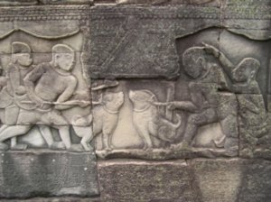 800 year-old carving in Bayon of dog fighting