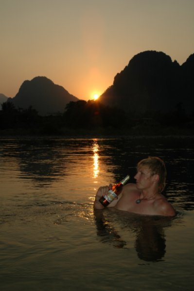 Enjoying a Beerlao in the river at Vang Vieng