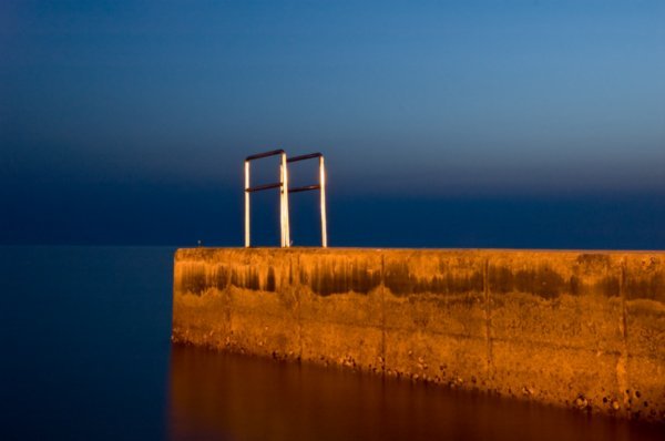 One of Piran's swimming platforms at night