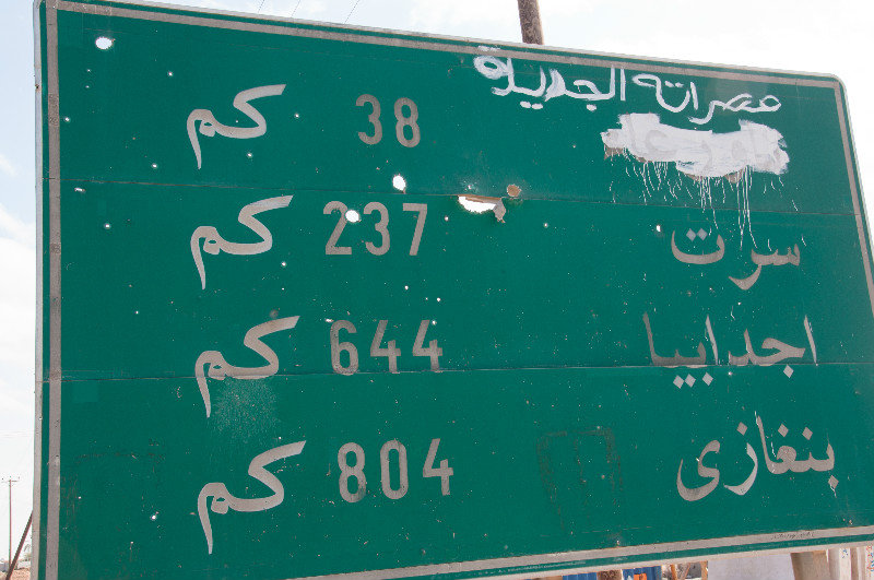 Arabic signs with bullet holes