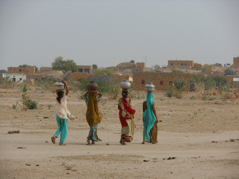 Village women carrying water from the well
