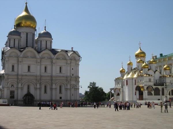Mini square surrounded by gold churchs inside the Kremlin.