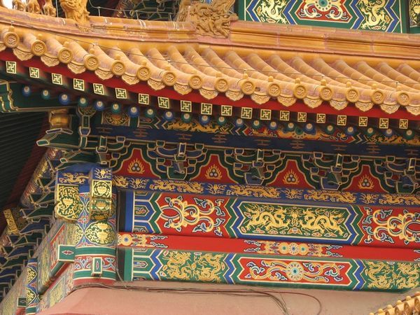 Intircate and colourfull designs on the temple arches.