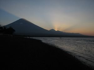 The sun disappearing behind Mount Agung.