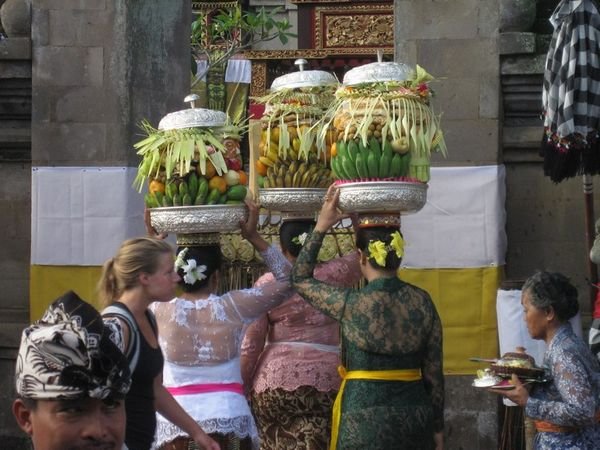 Ladies bringing their offerings to the temple.