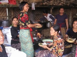 The ladies of the village preparing food for the workers.