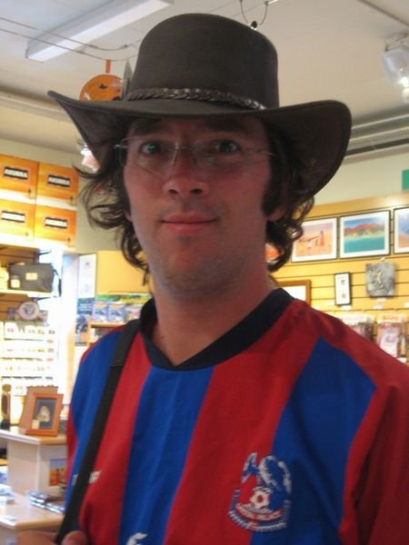 Trying out the Aussie gear in the gift shop.
