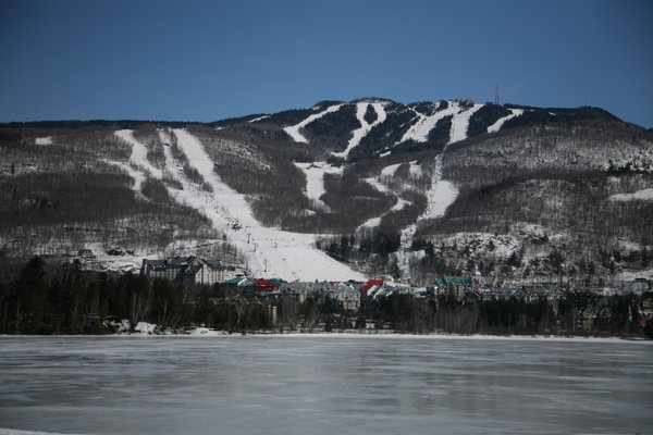 The South face of Tremblant over the lake