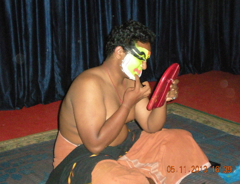 Kathakali dancer getting ready