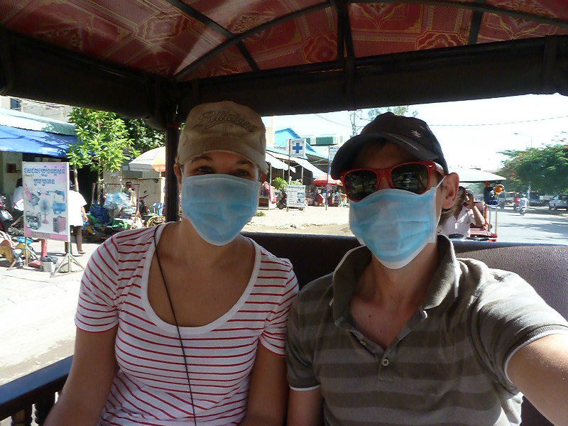 Phnom Penh - necessary face masks in our tuktuk