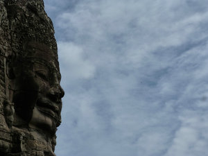 Angkor Thom (Prasat Bayon) - face of a god-king looks out over the jungle
