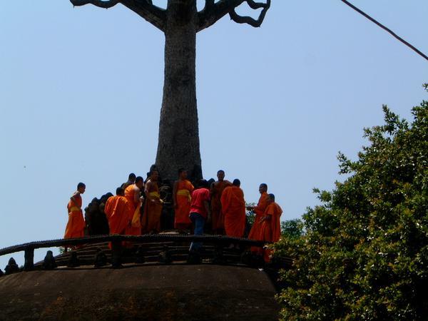  a group of monks on top of one of the Monuments