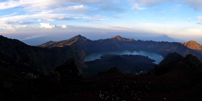 With the shadows of the mountain at the background