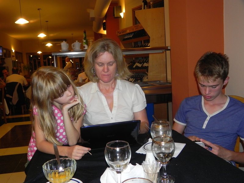 Mum writing the blog in nice restaurant