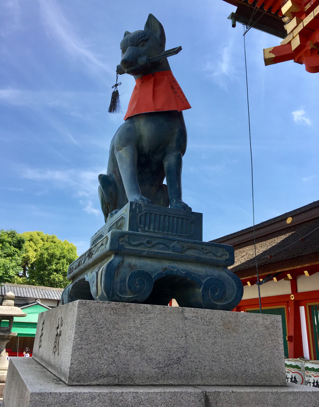 Fox guards rice at Fushimi Inari shrine