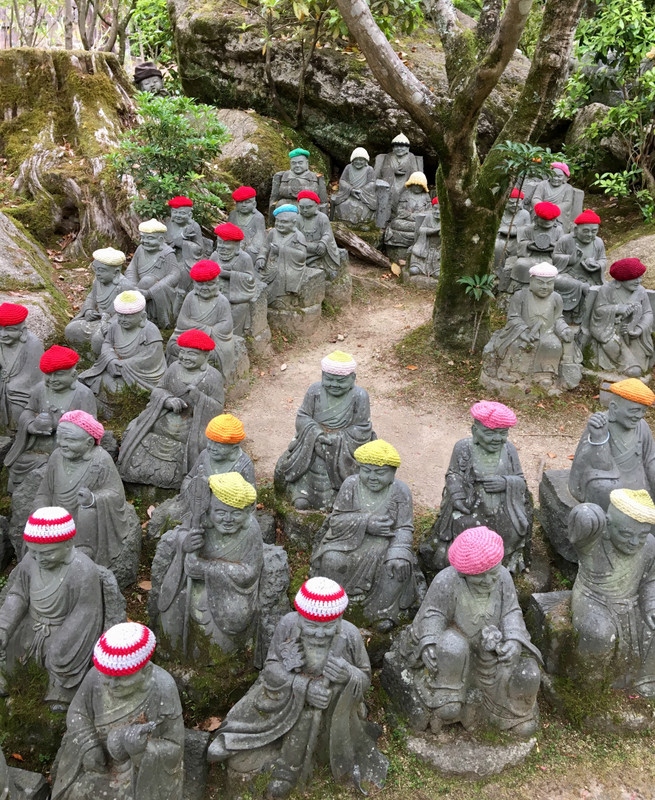 small statues of Shaka Norai disciples with colourful caps by Diasho-in temple