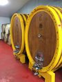 wine barrels in cool ageing room
