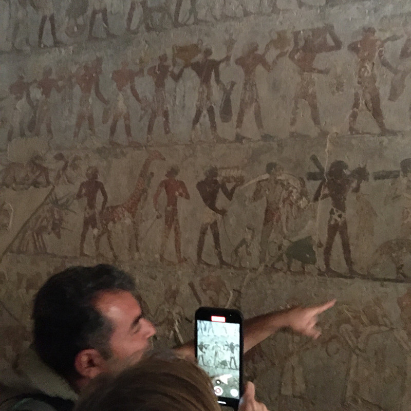 Migo explains symbols in a Tomb