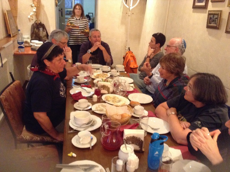Trekkers and guides ending meal