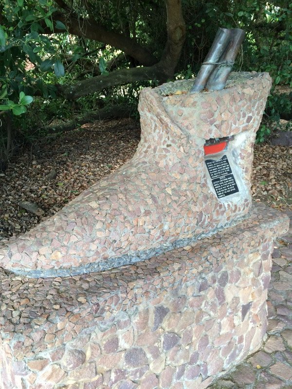 put letters into the boot at The Post Office Tree mailbox