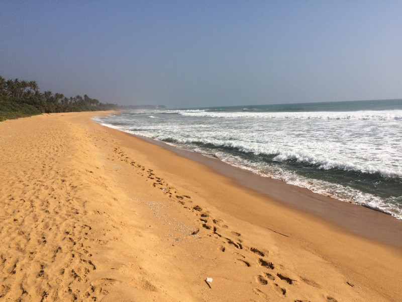 waves lap the shore behind Aditya