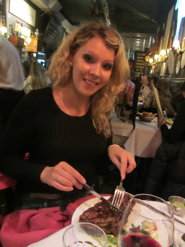 Alice tucking into her steak at La Cabrera
