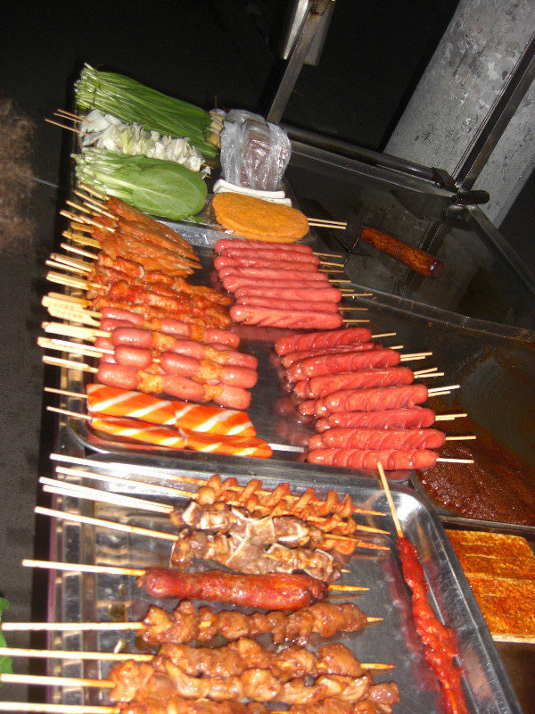 Meat and veggies on sticks to be grilled.